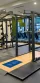 Gym with machines and weights.